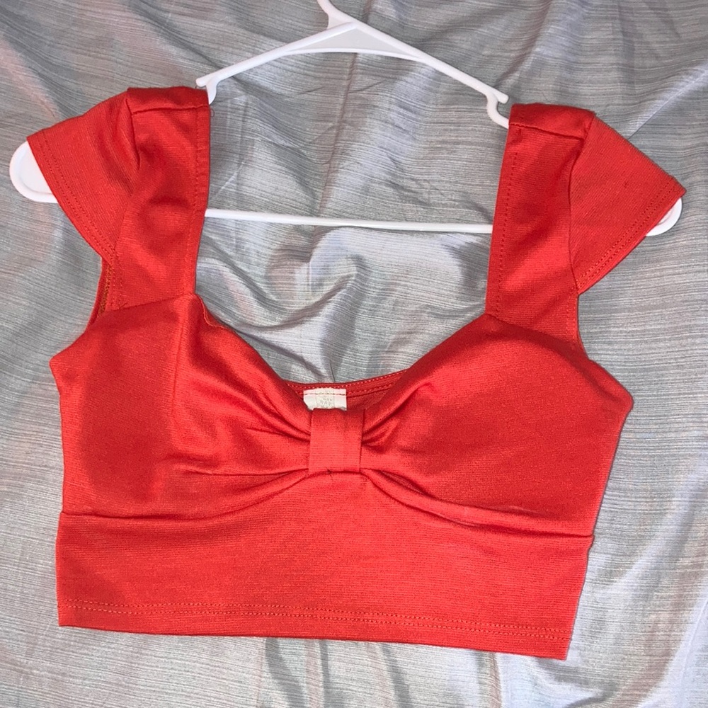 Bright orange/red crop top